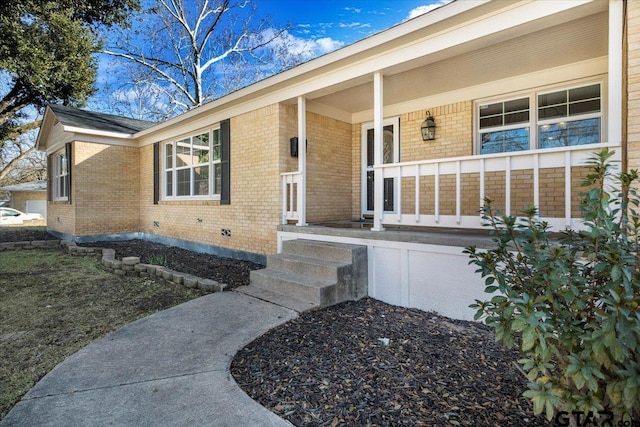 entrance to property with a porch