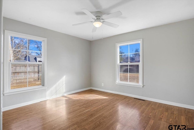 unfurnished room featuring ceiling fan and light wood-type flooring