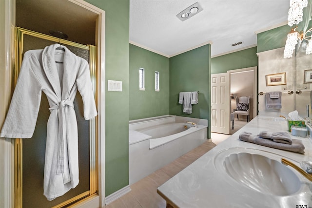 full bath featuring a bath, a chandelier, wood finished floors, a shower stall, and vanity