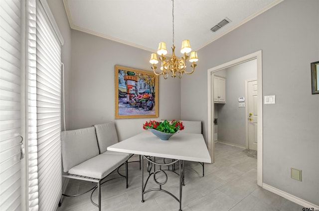 dining area with visible vents, crown molding, baseboards, and an inviting chandelier