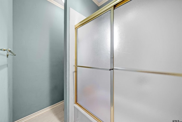 full bath featuring baseboards and a shower with door