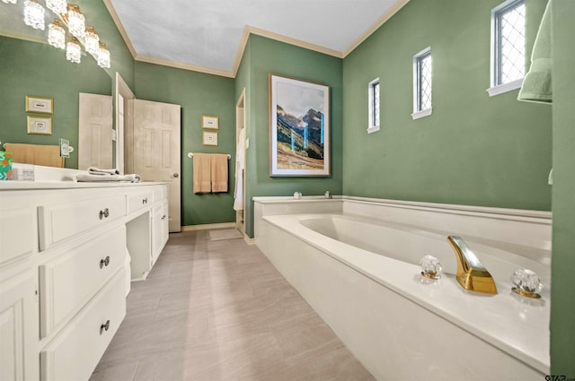 full bathroom with baseboards, a garden tub, crown molding, and vanity