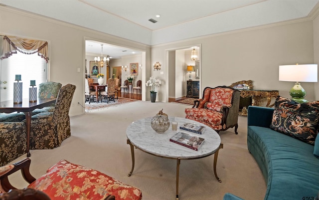 carpeted living room with visible vents, baseboards, a chandelier, and crown molding