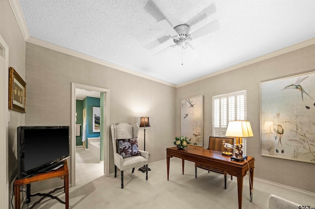 office area with ceiling fan, light carpet, ornamental molding, and a textured ceiling