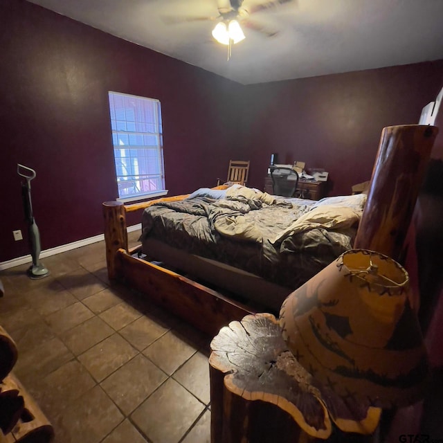 bedroom with tile patterned floors and ceiling fan