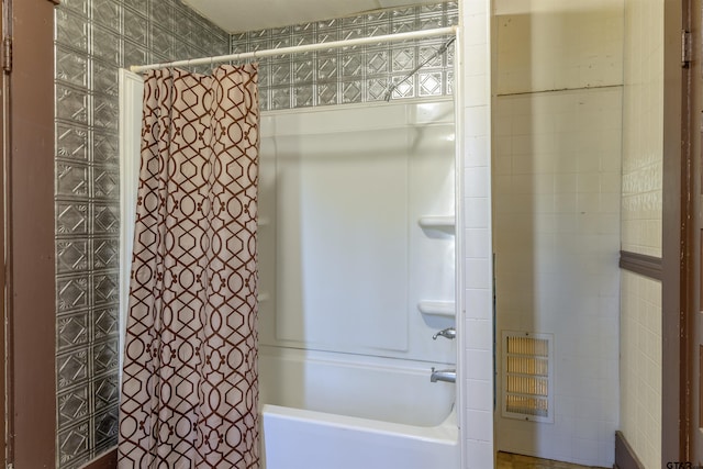 bathroom featuring shower / bath combination with curtain