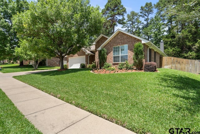 9190 Teal Flight Way, Tyler, TX 75703 - view of front facade featuring brick siding, driveway, a garage, and a chimney