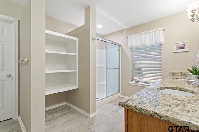9190 Teal Flight Way, Tyler, TX 75703 - full bath with vanity, a stall shower, baseboards, and a chandelier