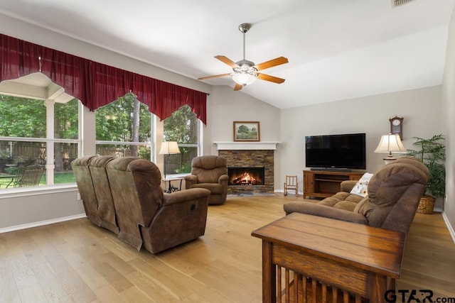 9190 Teal Flight Way, Tyler, TX 75703 - living room featuring ceiling fan, light wood-style floors, baseboards, and vaulted ceiling