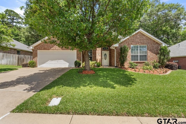 9190 Teal Flight Way, Tyler, TX 75703 - view of property hidden behind natural elements with driveway, brick siding, and an attached garage