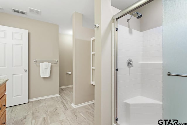 9190 Teal Flight Way, Tyler, TX 75703 - full bathroom with vanity, a shower stall, baseboards, and marble look tiles