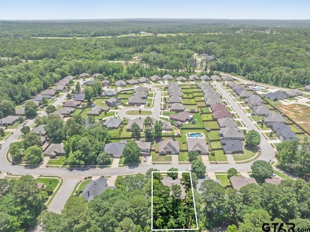 9190 Teal Flight Way, Tyler, TX 75703 - aerial overview of property's location with a forest, property parcel outlined, and nearby suburban area