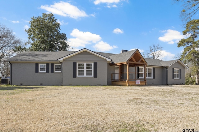 single story home featuring a porch, a front lawn, and central air condition unit