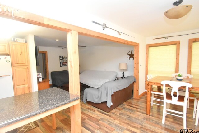 1611 County Road 1858, Yantis, TX 75497 - bedroom with light wood-type flooring and freestanding refrigerator