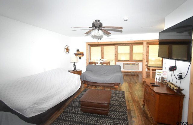 1611 County Road 1858, Yantis, TX 75497 - bedroom with hardwood / wood-style floors and a wall unit AC