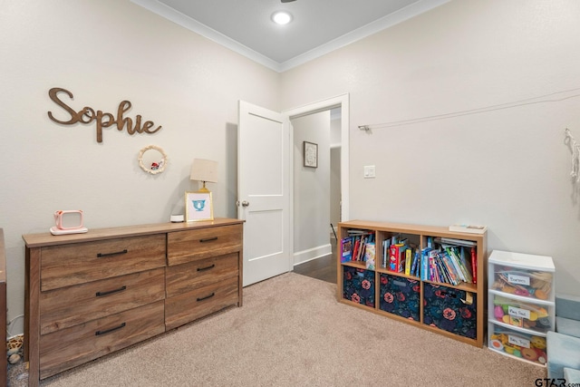 game room with ornamental molding and light carpet