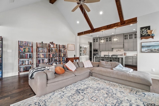 living room featuring high vaulted ceiling, dark wood-type flooring, ceiling fan, and beamed ceiling