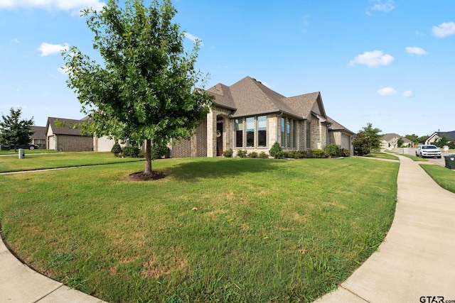 view of front of home with a front yard