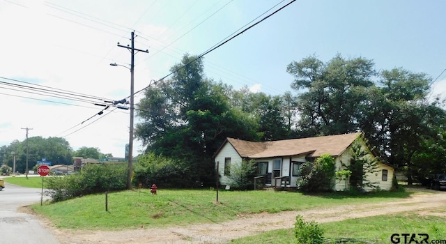 exterior space with a front yard