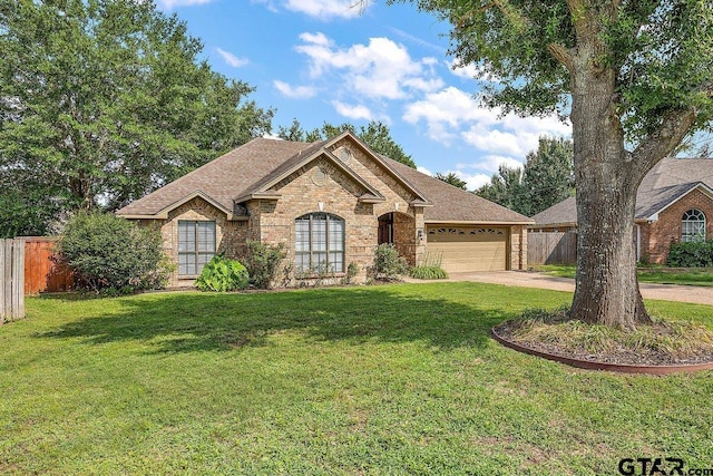 19173 Greenleaf Dr, Flint, TX 75762 - view of front of property with brick siding, driveway, a garage, and a shingled roof