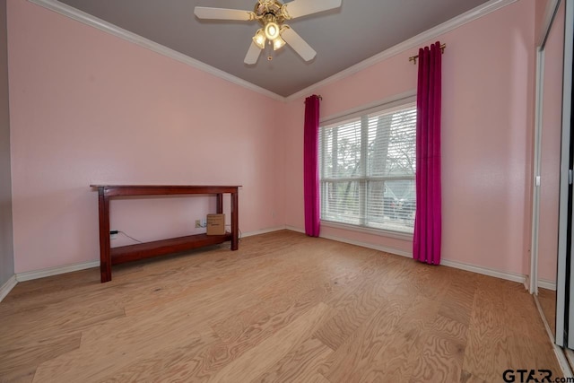 unfurnished room with light wood-type flooring, ornamental molding, and ceiling fan