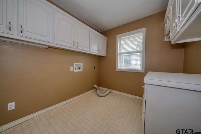 laundry area with cabinets, hookup for an electric dryer, and hookup for a washing machine