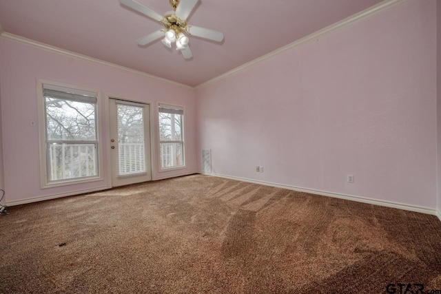 carpeted empty room featuring crown molding and ceiling fan