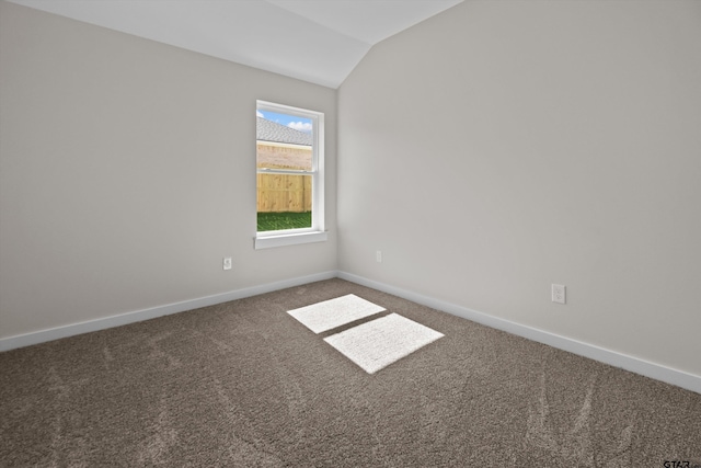 16509 Crossing Cir, Lindale, TX 75771 - carpeted empty room with lofted ceiling and baseboards