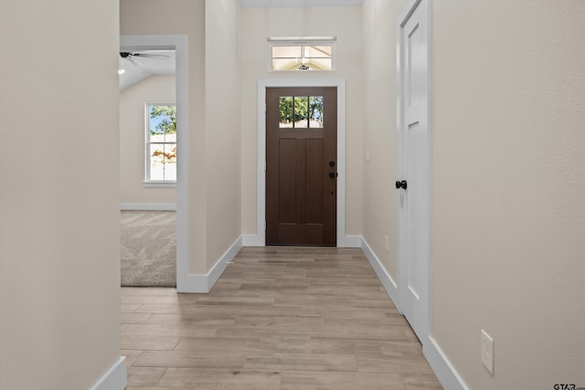 16509 Crossing Cir, Lindale, TX 75771 - foyer entrance featuring plenty of natural light, light wood-style flooring, and ceiling fan