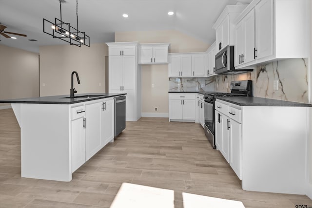 16509 Crossing Cir, Lindale, TX 75771 - kitchen featuring stainless steel appliances, dark countertops, ceiling fan, recessed lighting, and white cabinets