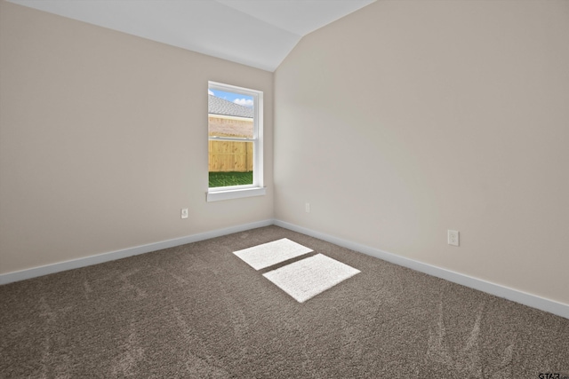 16509 Crossing Cir, Lindale, TX 75771 - spare room with vaulted ceiling and carpet flooring