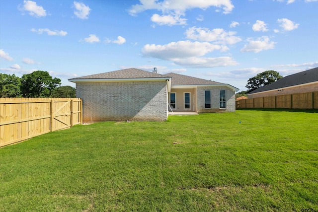 16509 Crossing Cir, Lindale, TX 75771 - rear view of property with a fenced backyard and brick siding