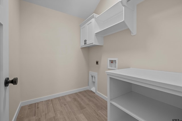 16509 Crossing Cir, Lindale, TX 75771 - laundry area featuring electric dryer hookup, cabinet space, washer hookup, and light wood-style floors