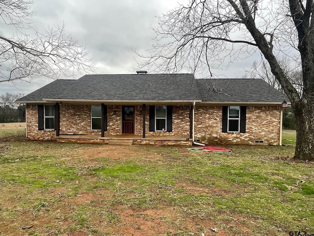 ranch-style home with a front lawn