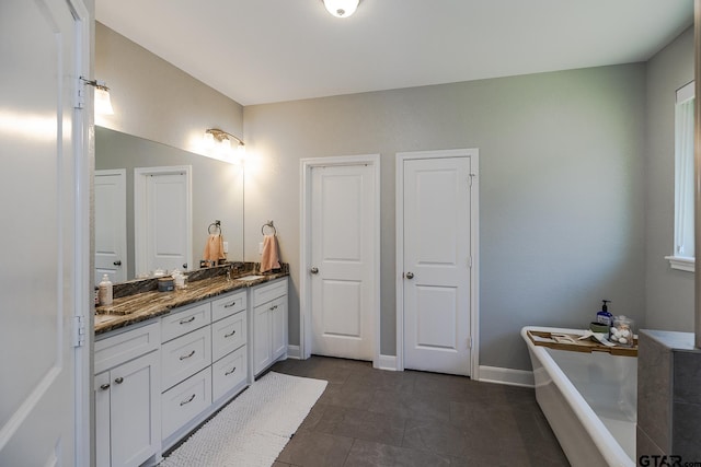 7317 Hearthstone Ln, Tyler, TX 75703 - full bathroom with double vanity, a tub to relax in, and tile patterned flooring