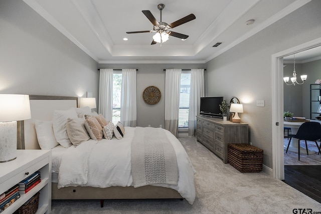 7317 Hearthstone Ln, Tyler, TX 75703 - bedroom with a tray ceiling, ornamental molding, a chandelier, an office area, and a ceiling fan