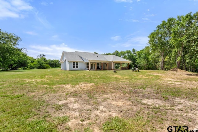 15988 C R 1151, Tyler, TX 75704 - back of house featuring a yard