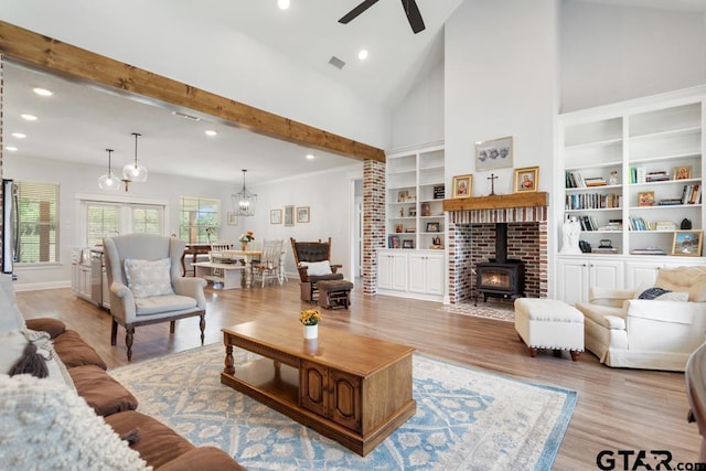15988 C R 1151, Tyler, TX 75704 - living area featuring a wood stove, a ceiling fan, light wood-type flooring, and recessed lighting
