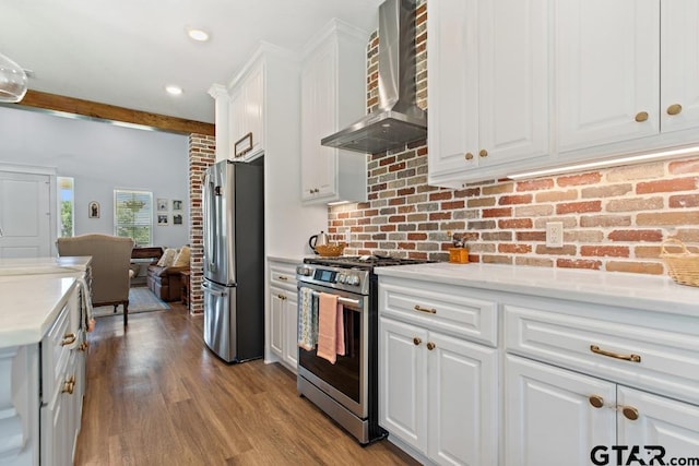 15988 C R 1151, Tyler, TX 75704 - kitchen with stainless steel appliances, wall chimney range hood, white cabinetry, light countertops, and wood finished floors