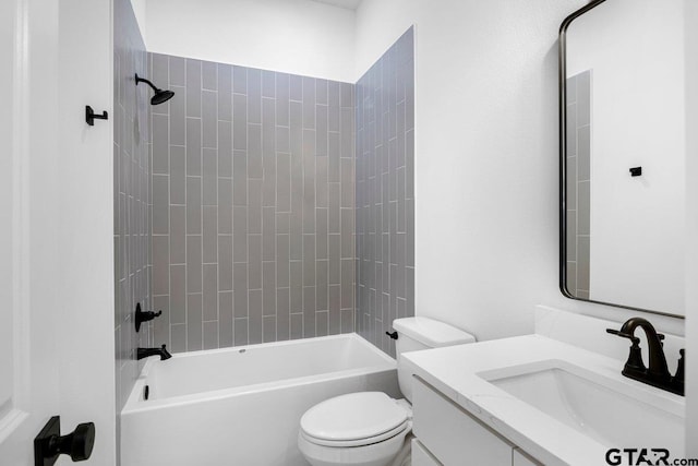 full bathroom featuring vanity, toilet, and tiled shower / bath