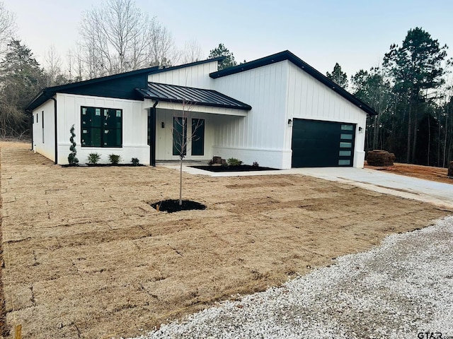 modern farmhouse featuring a garage