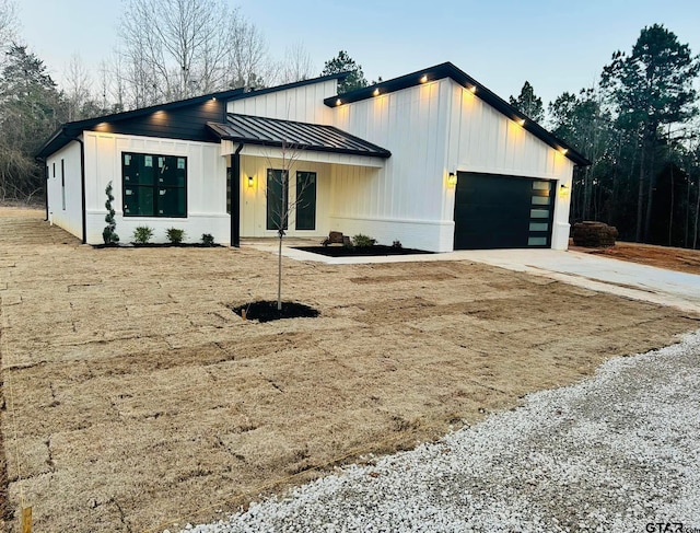 modern farmhouse with a garage