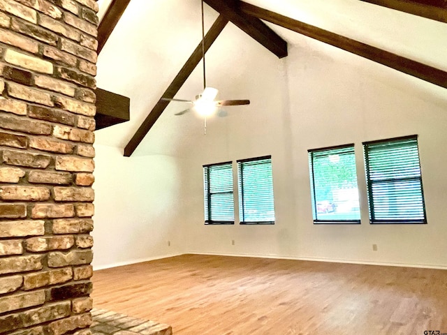 609 Francis St, Hawkins, TX 75765 - unfurnished living room with beam ceiling, wood finished floors, high vaulted ceiling, a ceiling fan, and baseboards