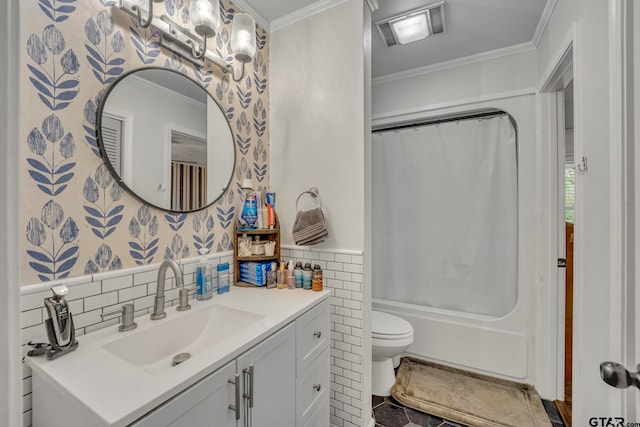 bathroom featuring toilet, vanity, and crown molding