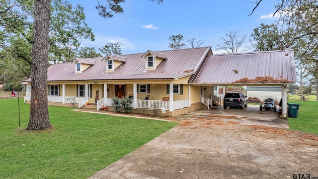 view of front facade with a porch, a carport, and a front lawn