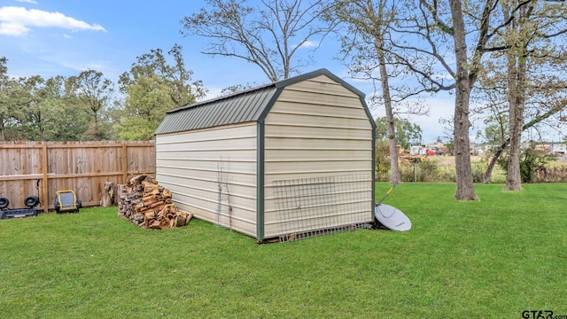 view of outdoor structure featuring a yard