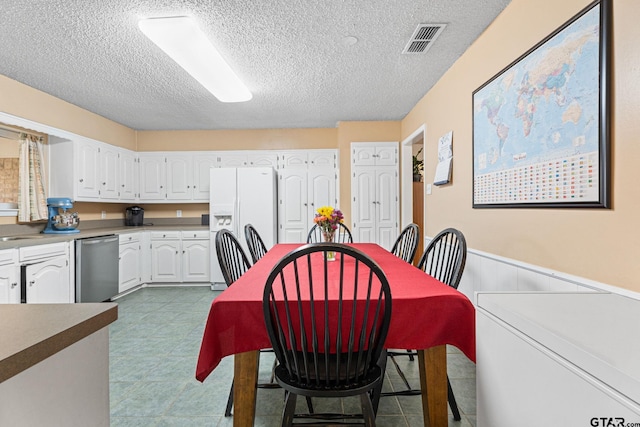 dining room with a textured ceiling