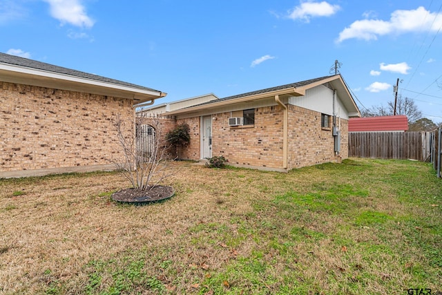 back of property featuring a yard