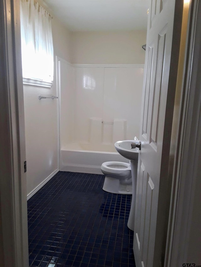 bathroom with shower / bath combination, tile patterned flooring, and toilet