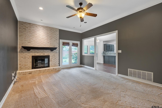 3110 Oleander Dr, Tyler, TX 75707 - unfurnished living room featuring carpet flooring, baseboards, visible vents, a ceiling fan, and crown molding